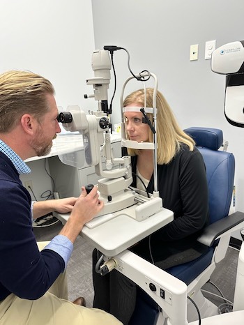 Photo of Dr. Smedley performing an eye exam
